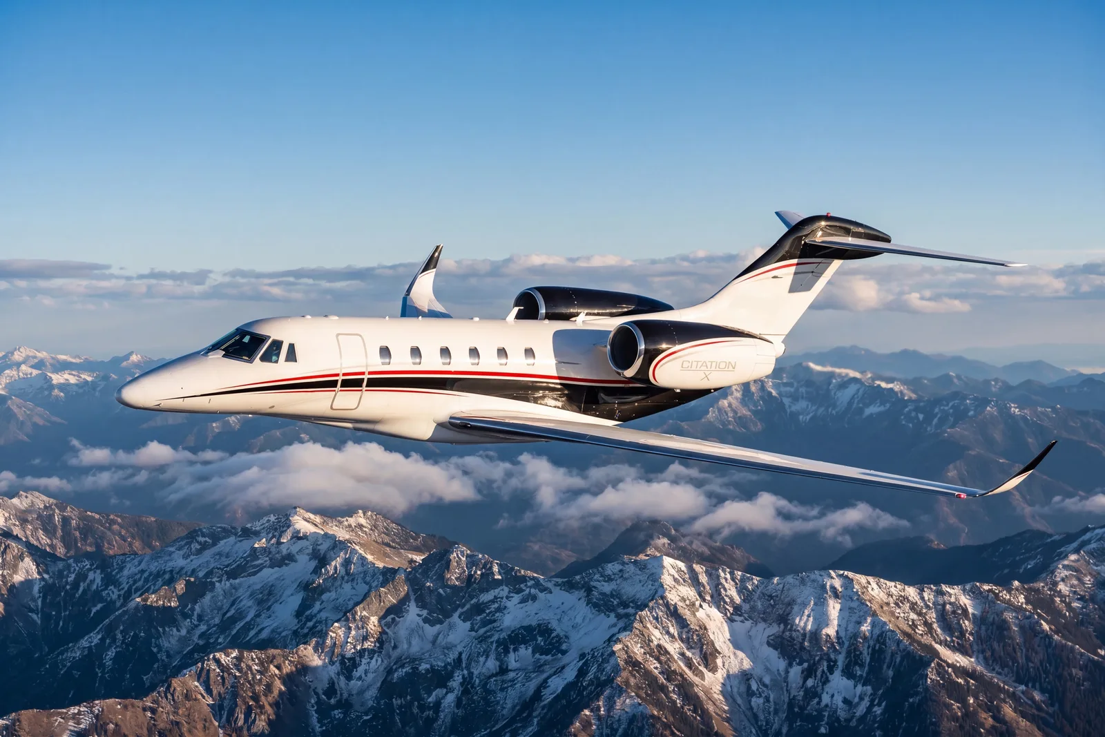 Citation X exterior in flight over mountains