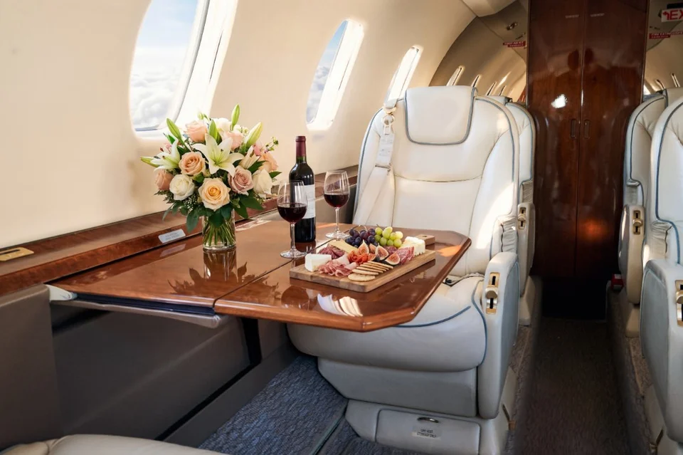 Citation XLS cabin with charcuterie and wine service staged in flight